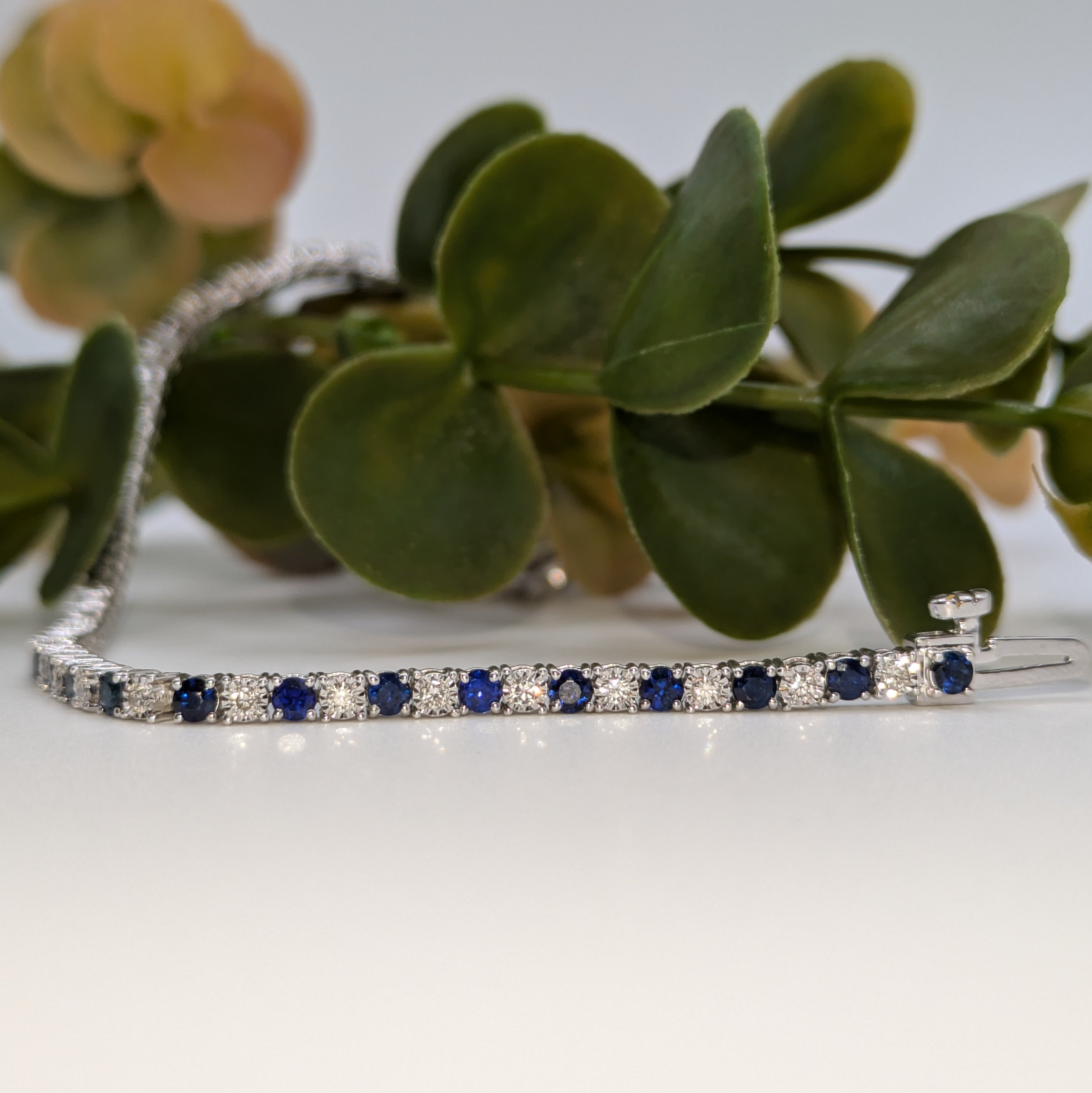 Sapphire with illusion set diamonds tennis bracelet F/VS1