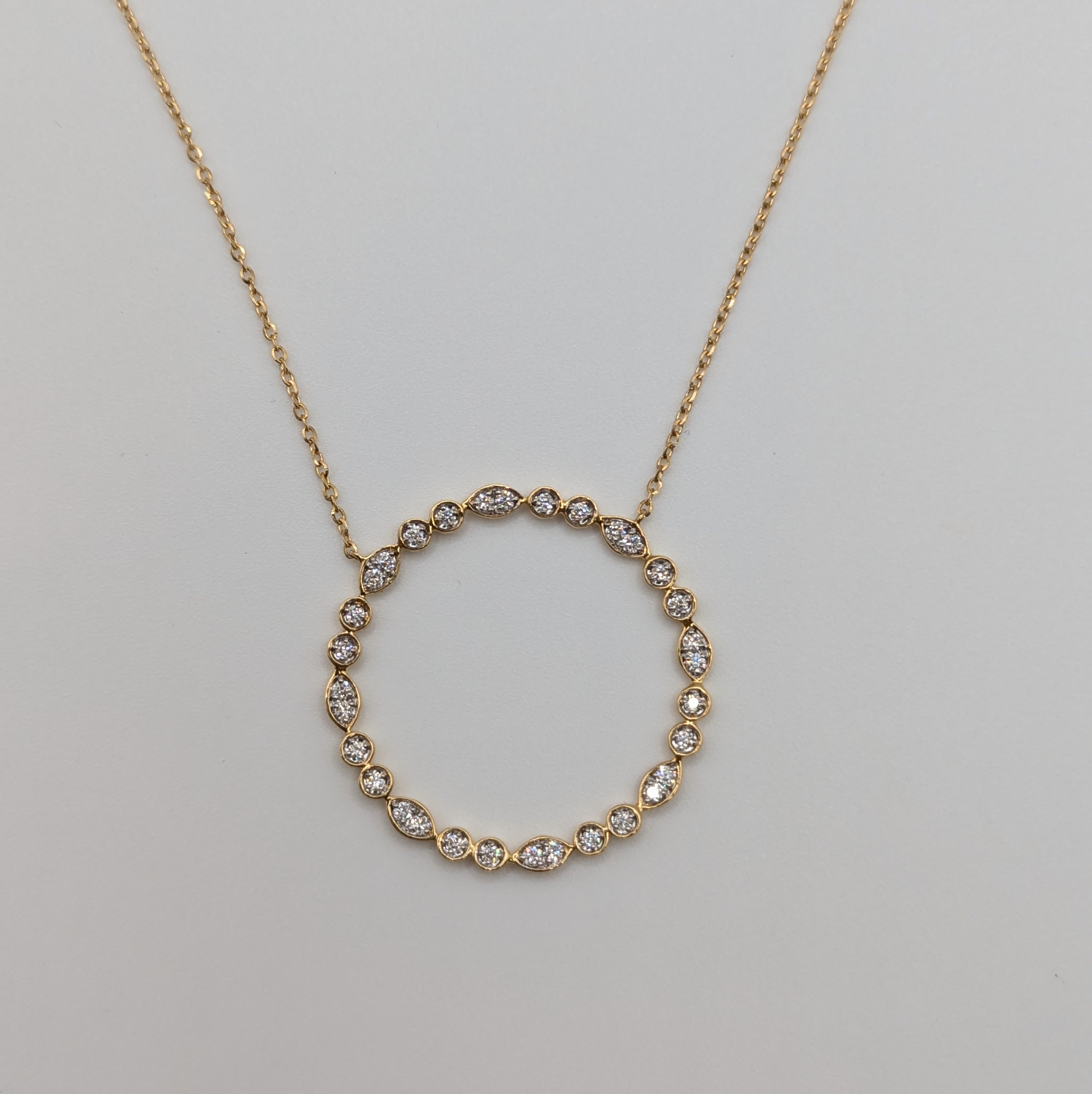 marquise and round style milgrain open cycle 18k yellow gold