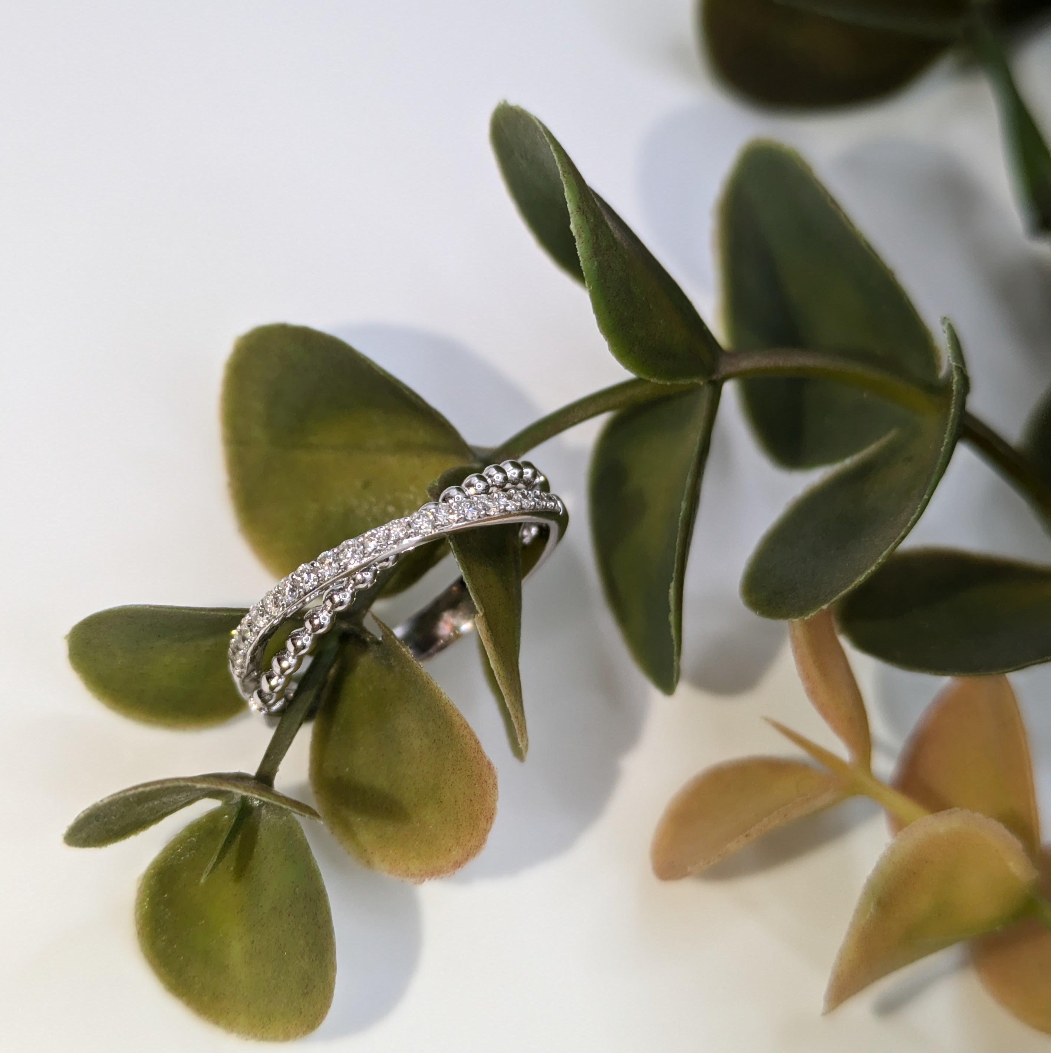 18k Crossover bands one beaded one half eternity style