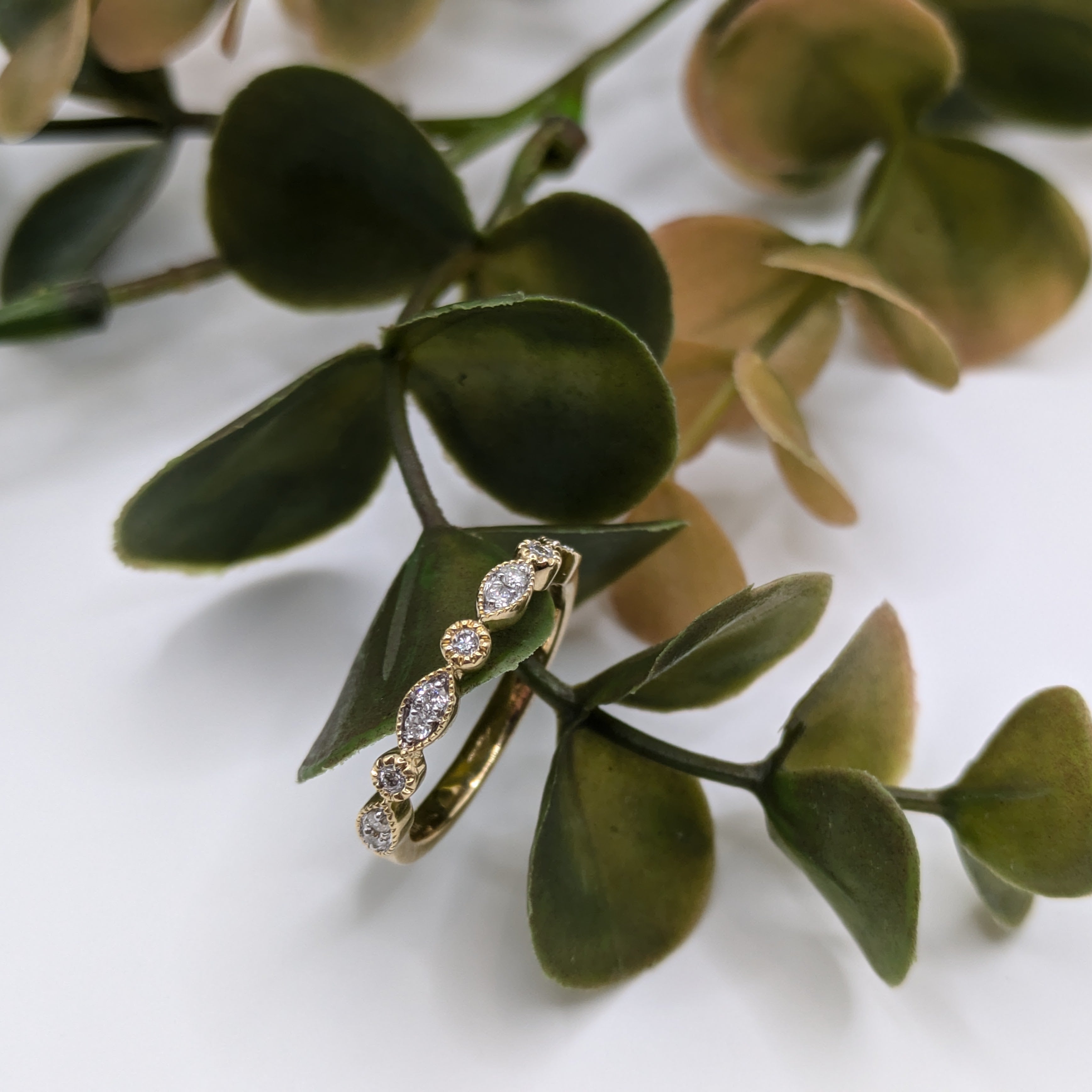 cluster marquise shape with rounds in milgrain design half eternity
