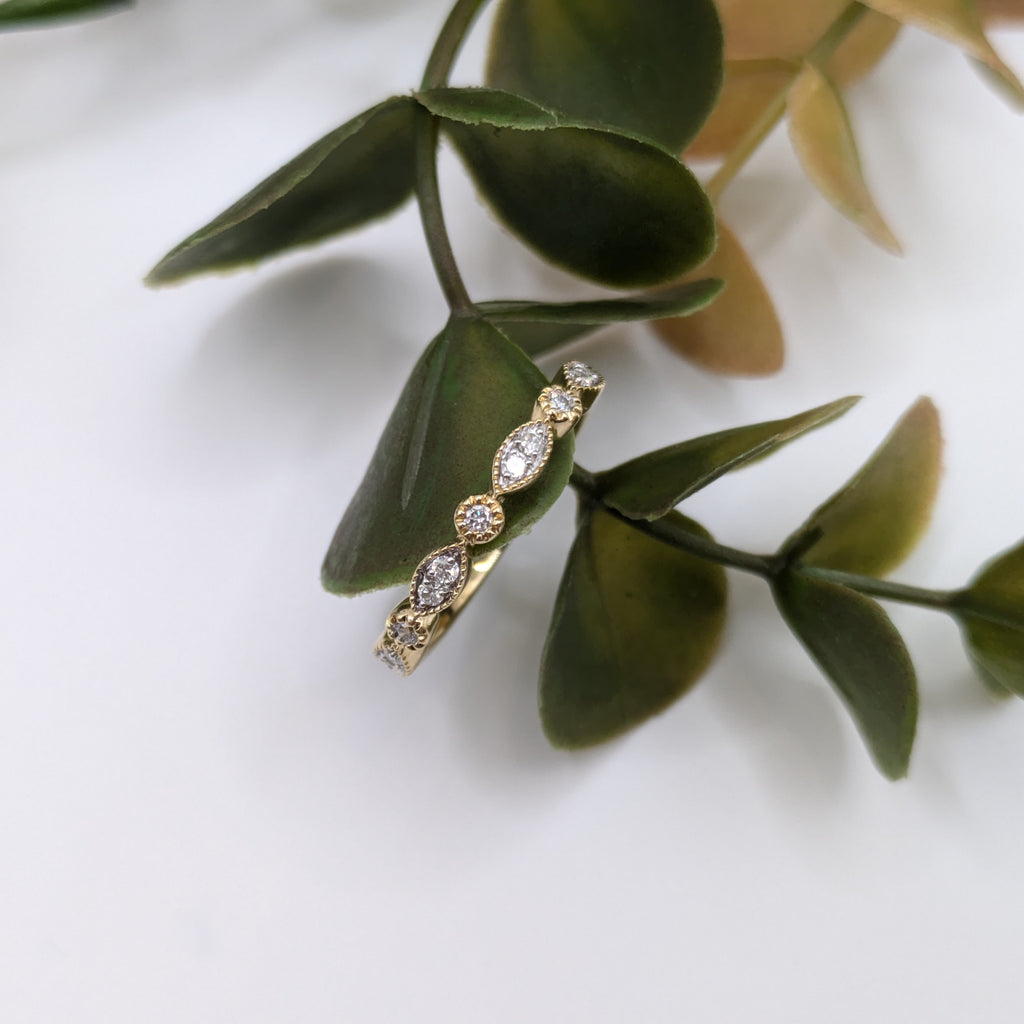 cluster marquise shape with rounds in milgrain design half eternity