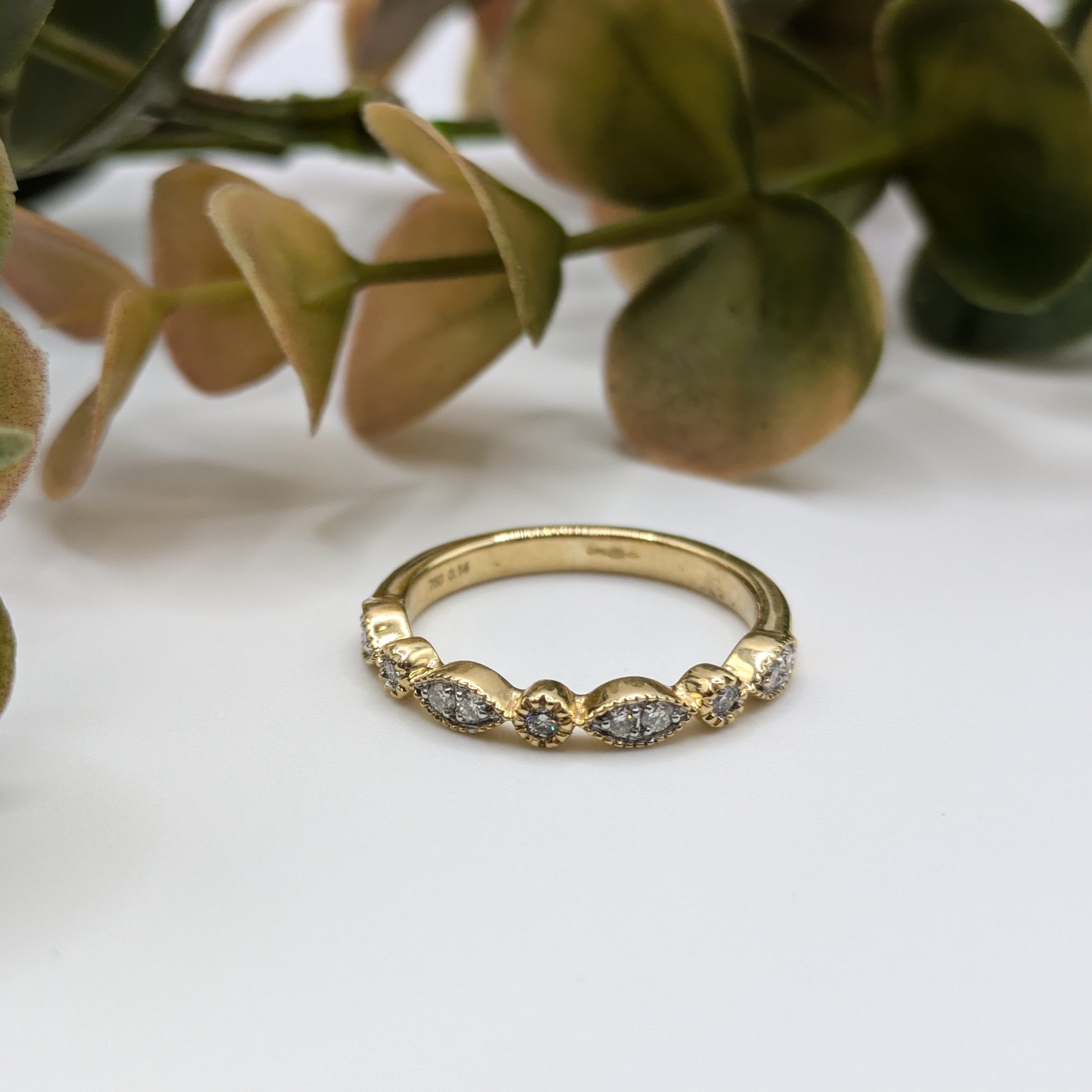 cluster marquise shape with rounds in milgrain design half eternity