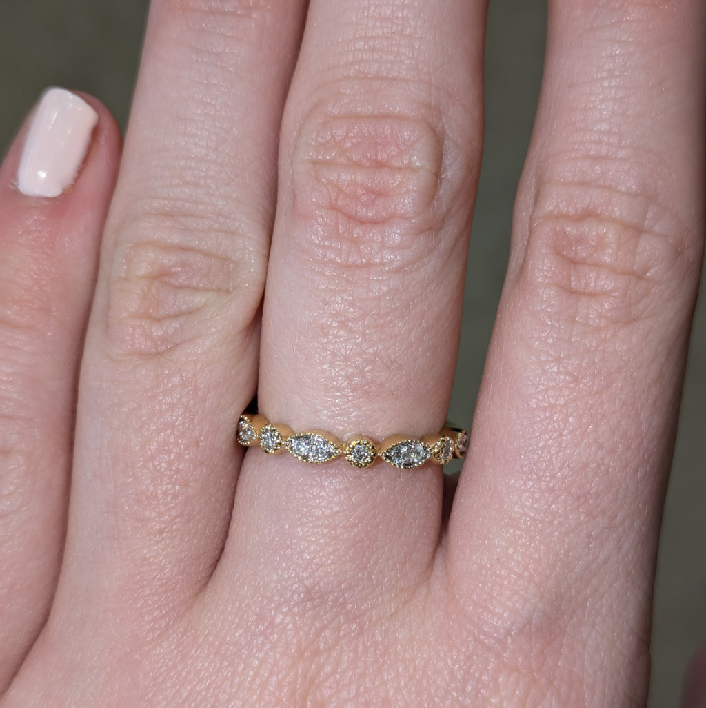 cluster marquise shape with rounds in milgrain design half eternity
