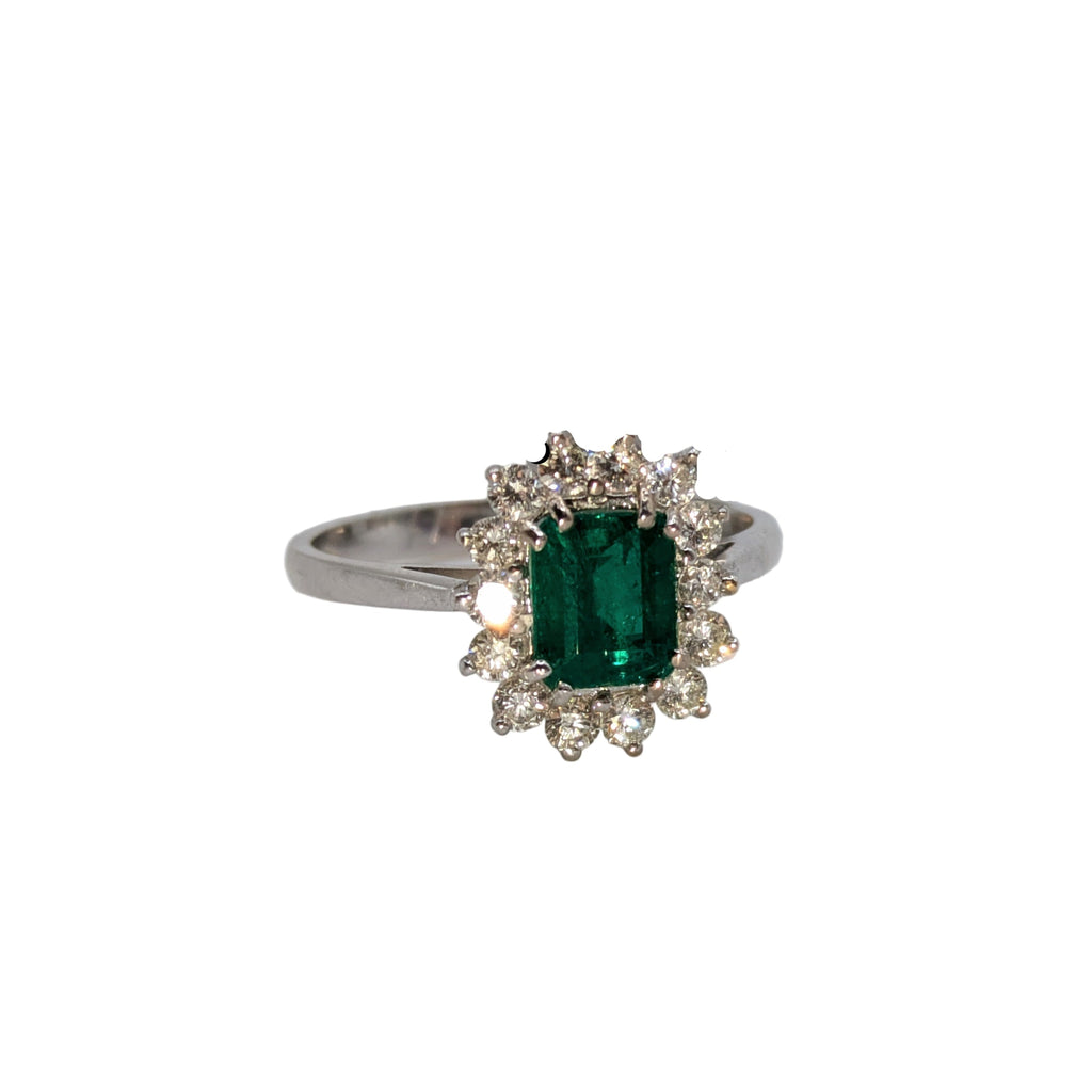 Emerald cut, emerald hem in diamond halo on 18k white gold ring