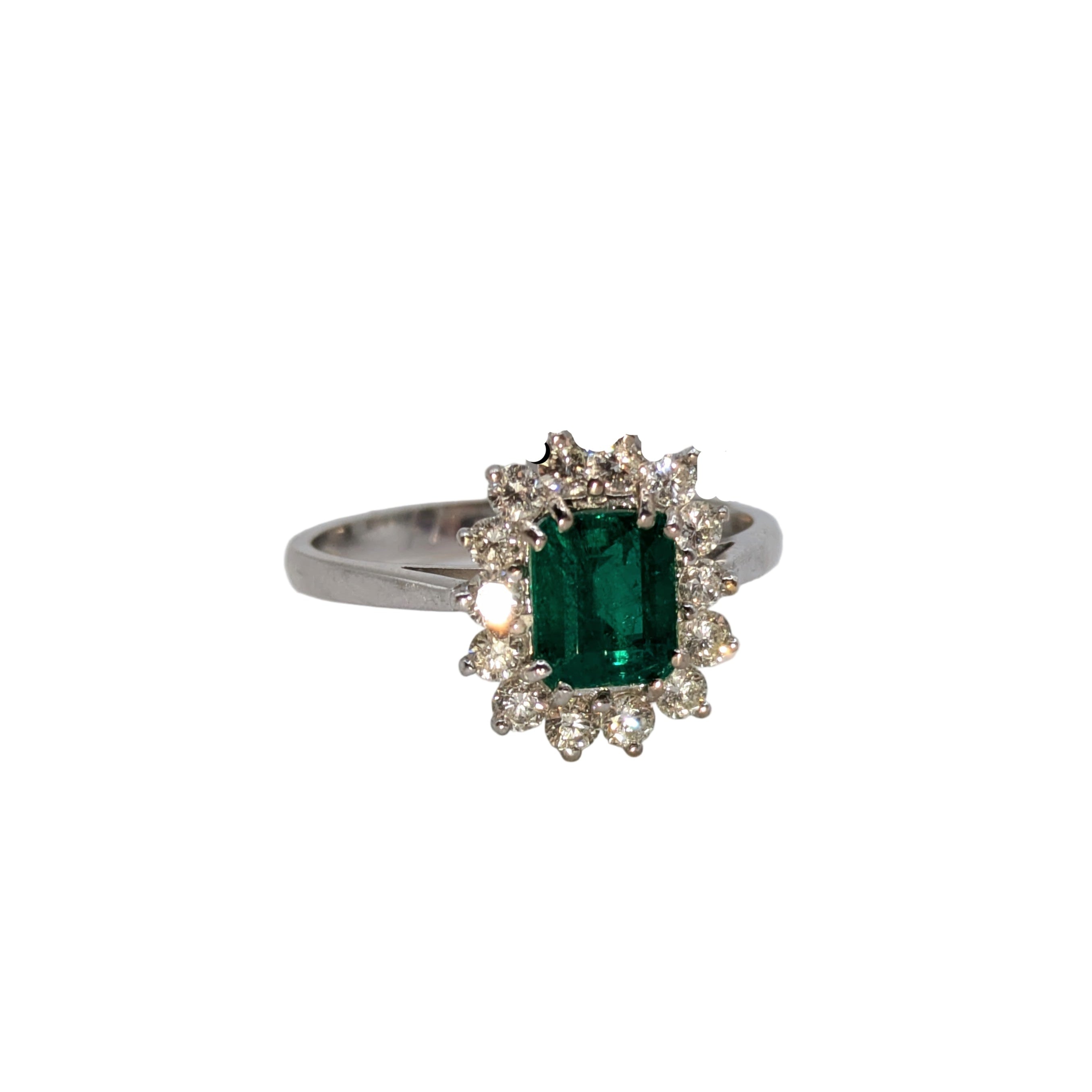 Emerald cut, emerald hem in diamond halo on 18k white gold ring