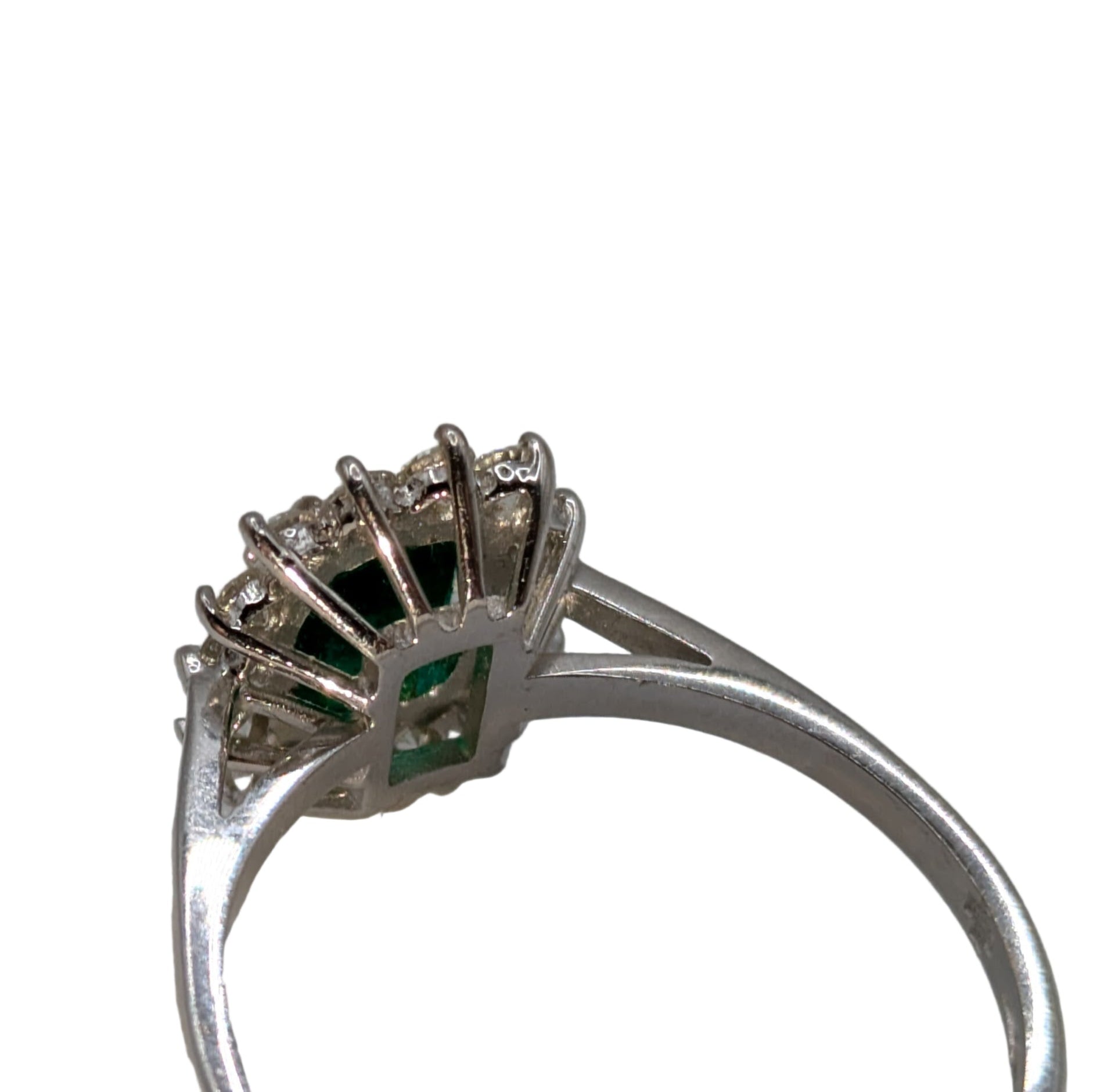 Emerald cut, emerald hem in diamond halo on 18k white gold ring