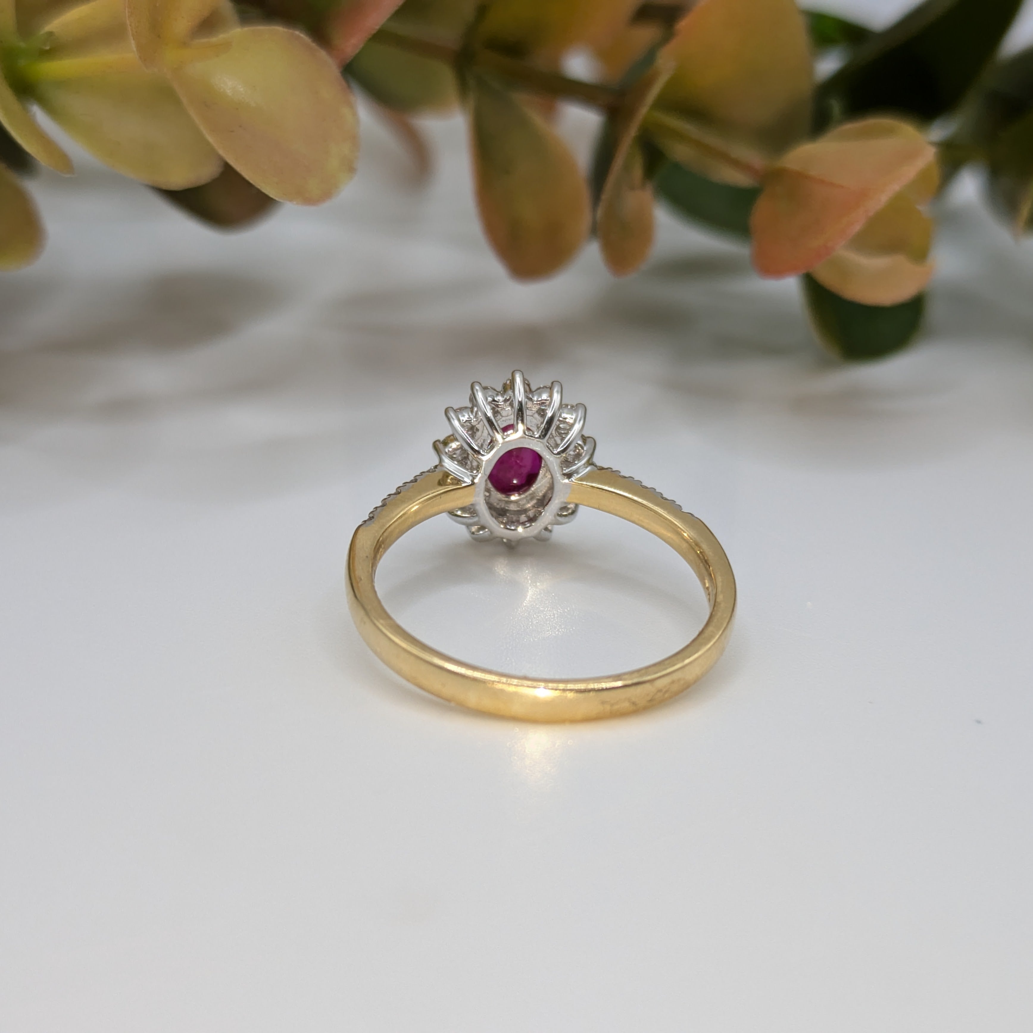 Ruby ring with flower style halo