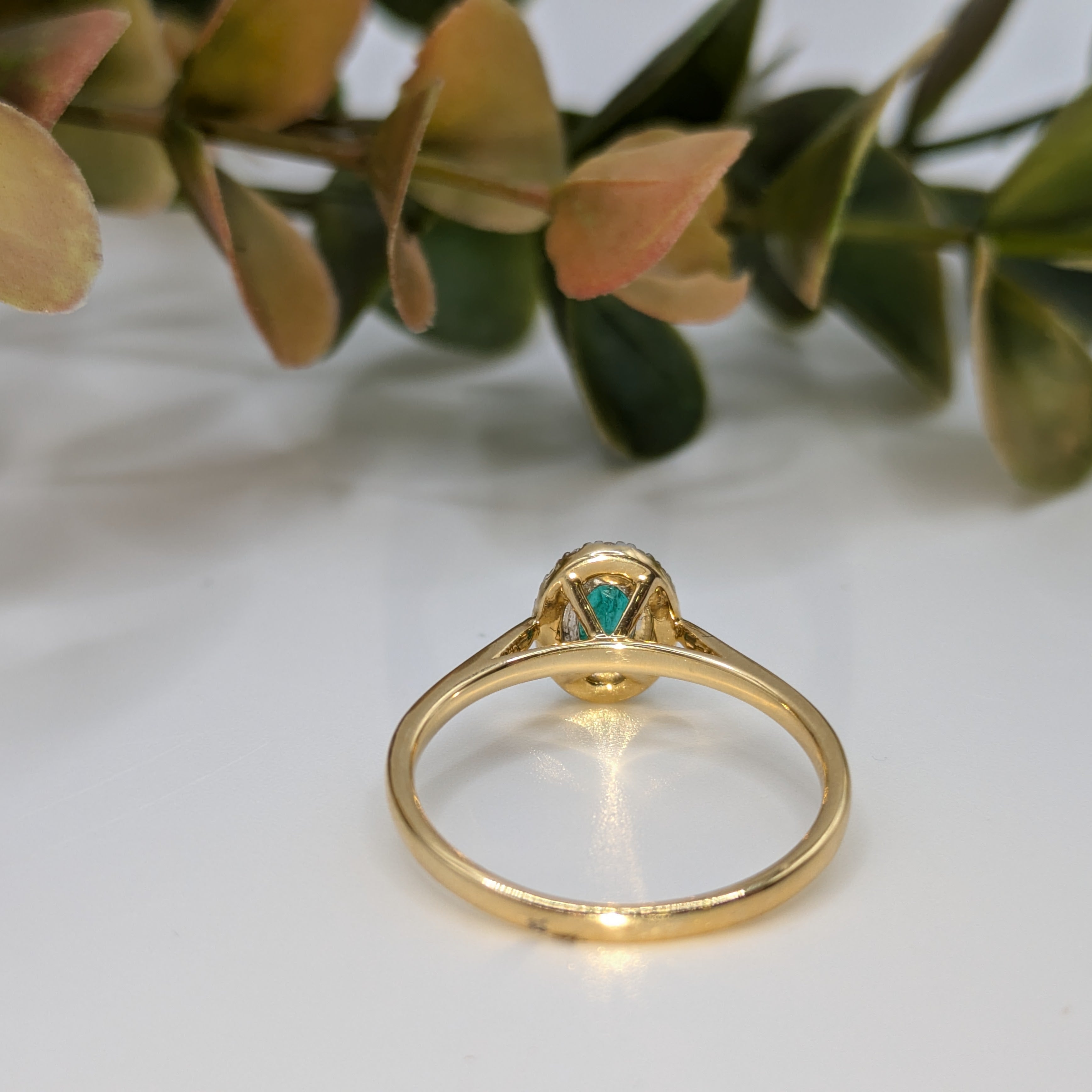 Emerald gemstone halo ring