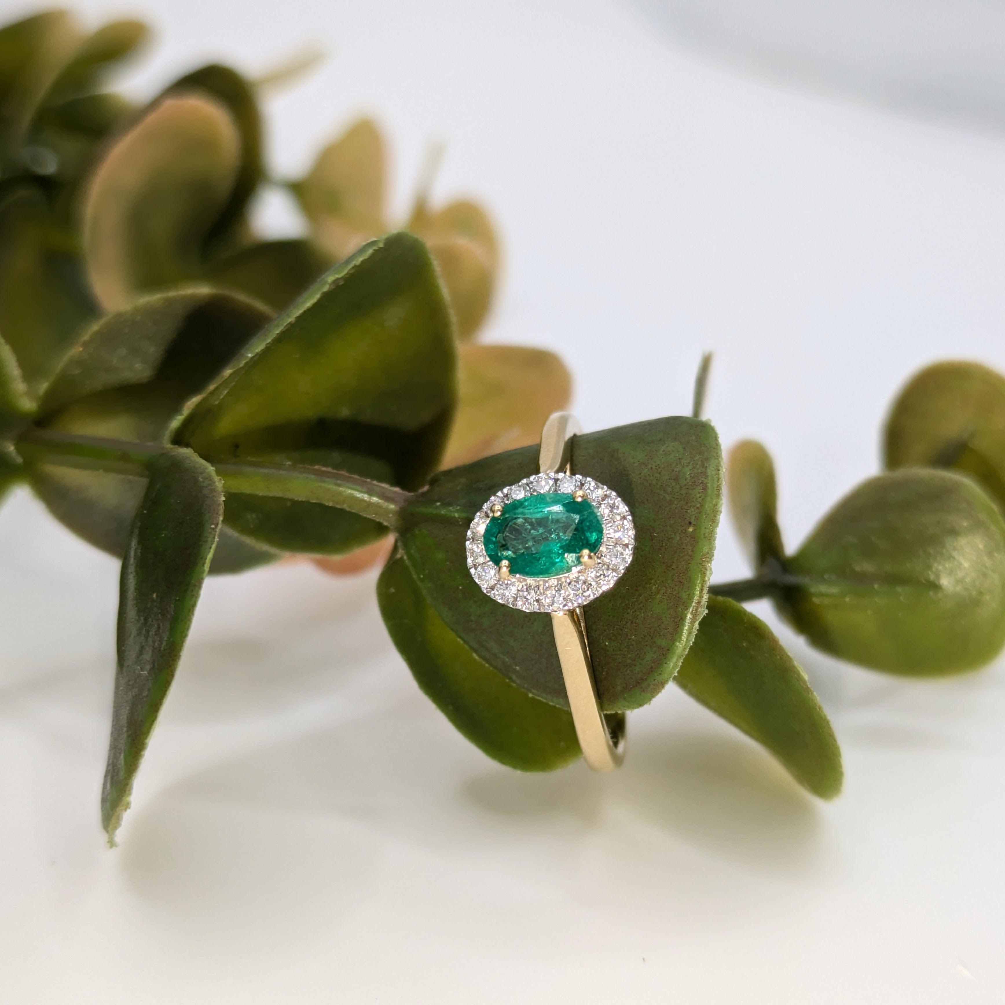Emerald gemstone halo ring
