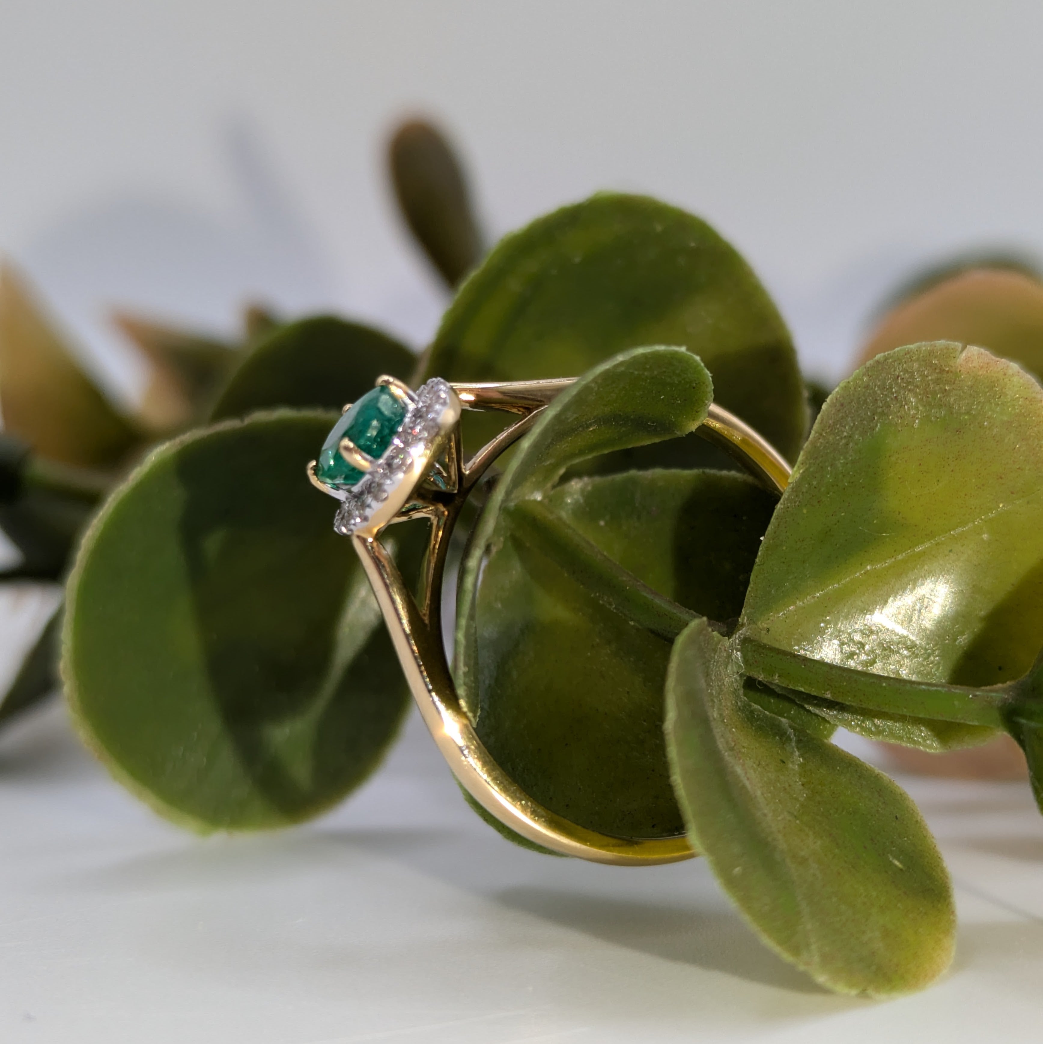 Emerald gemstone halo ring