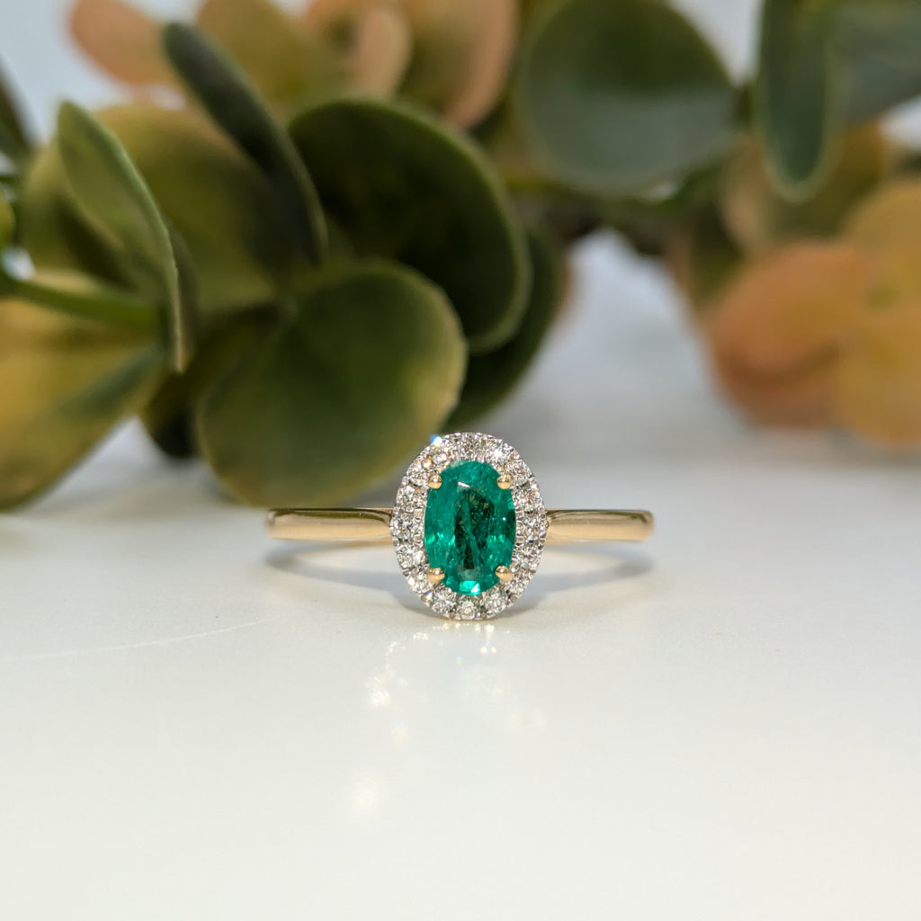 Emerald gemstone halo ring