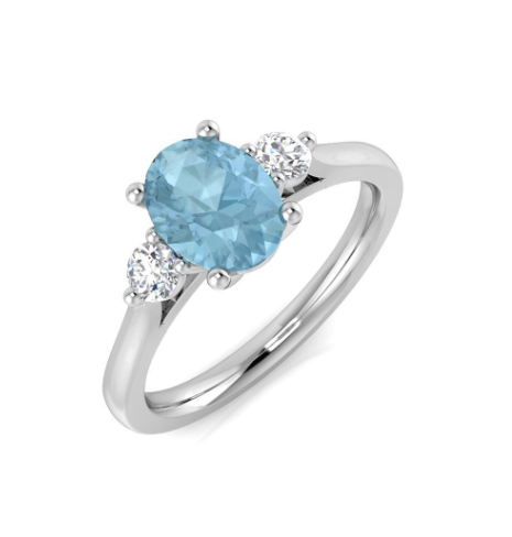 Oval aquamarine with round trilogy ring on 18k white gold